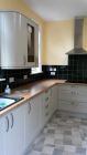 Completed kitchen including plasterboard  tiles and painting